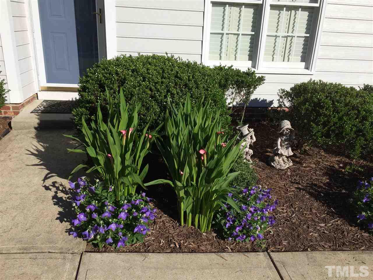 515 Windcrest Road Durham, NC 27713 - Photo 5 of 15 Lovely landscaped yard features blooming perennials.