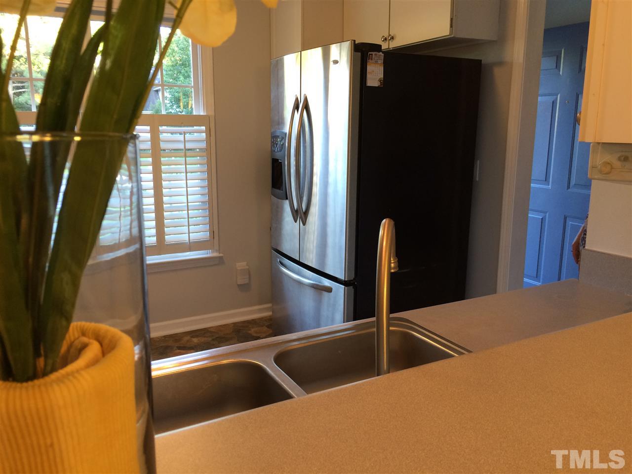 515 Windcrest Road Durham, NC 27713 - Photo 6 of 15 Stainless fridge stays! Check out the plantation shutters.