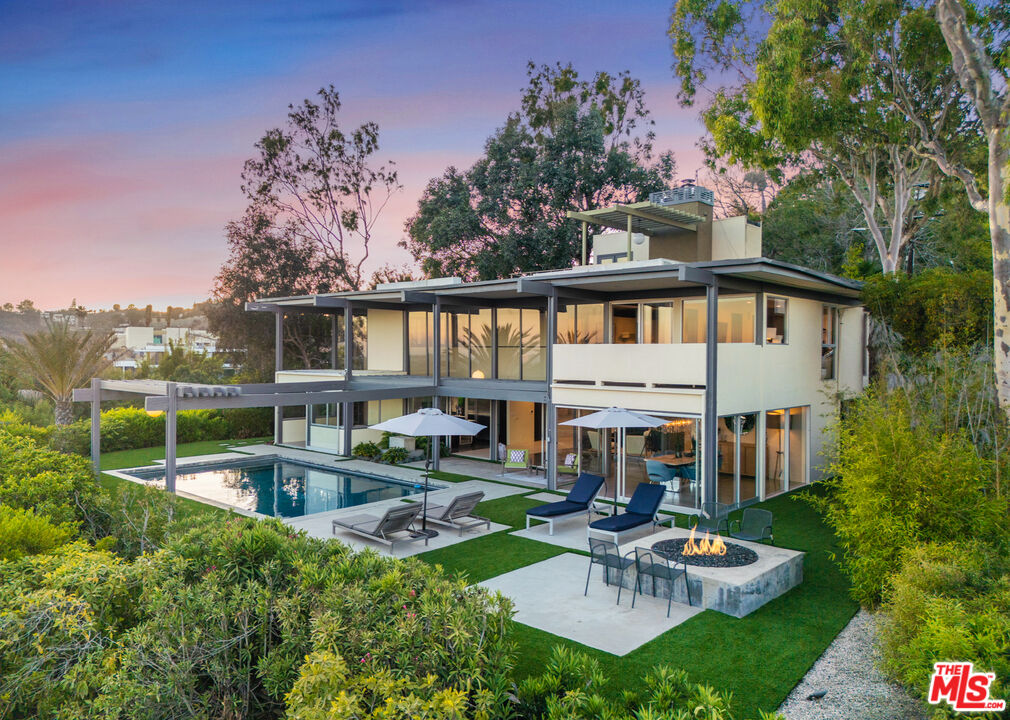 9892 Beverly Grove Drive Beverly Hills, CA 90210 - Photo 1 of 39 a view of backyard with swimming pool and patio