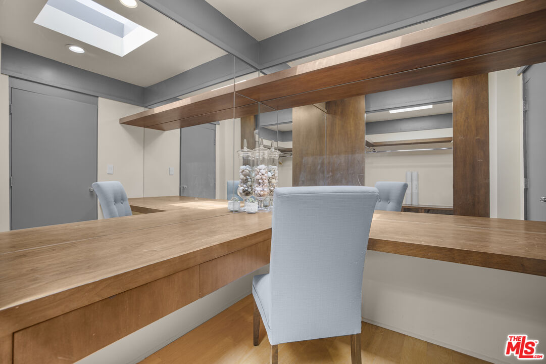 9892 Beverly Grove Drive Beverly Hills, CA 90210 - Photo 3 of 39 a view of kitchen with furniture and wooden floor