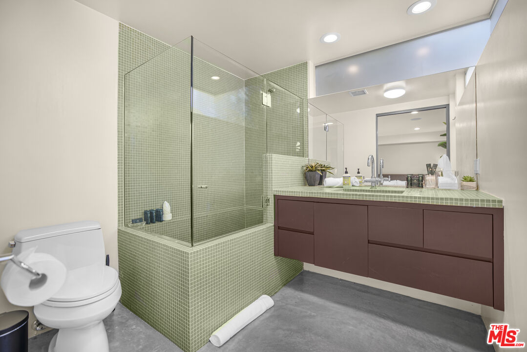 9892 Beverly Grove Drive Beverly Hills, CA 90210 - Photo 9 of 39 a bathroom with a sink toilet and shower