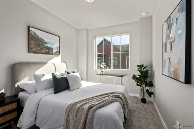 a bedroom with bed and a window