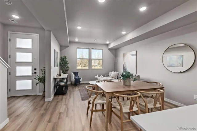 a view of a dining room with furniture window and wooden floor