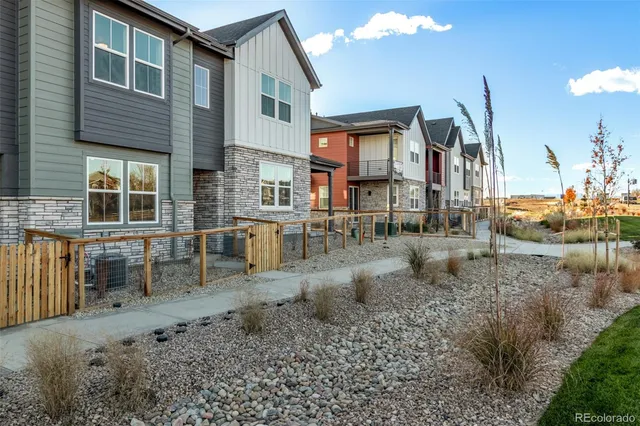 a view of a brick house with many windows