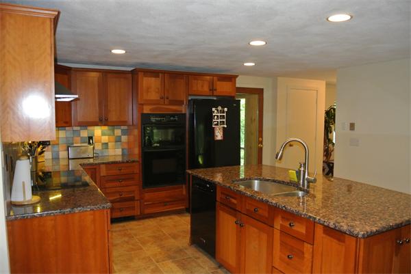 14 Augustine Road Groton, MA 01450 - Photo 8 of 30 a kitchen with granite countertop a sink and cabinets