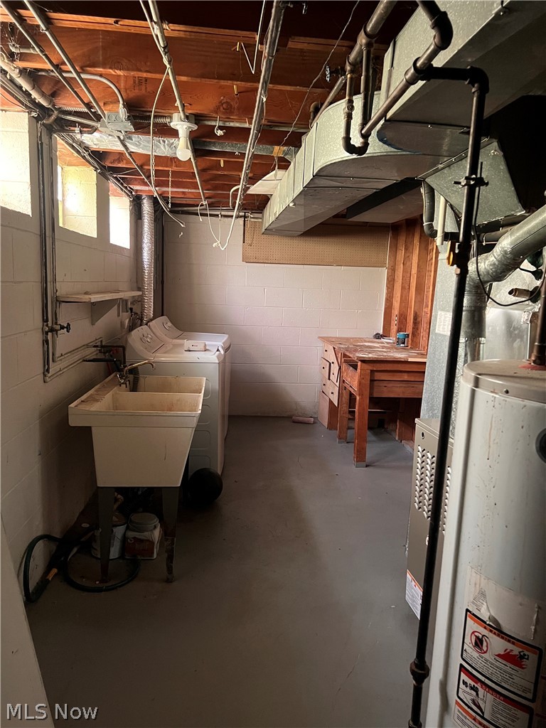 16350 Rockside Road Maple Heights, OH 44137 - Photo 34 of 34 Utility area featuring a laundry sink, exposed ceiling joists, and a painted concrete floor
