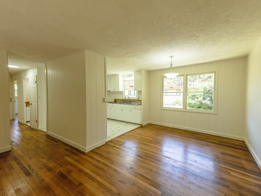 19-4035 Haunani Road Volcano, HI 96785 - Photo 3 of 25 a view of an empty room with window and wooden floor