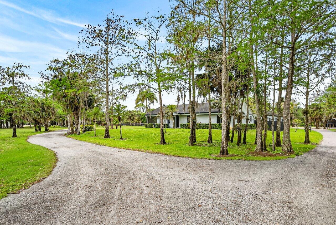 2741 Buck Ridge Trail Loxahatchee, FL 33470 - Photo 6 of 38 Driveway and House view