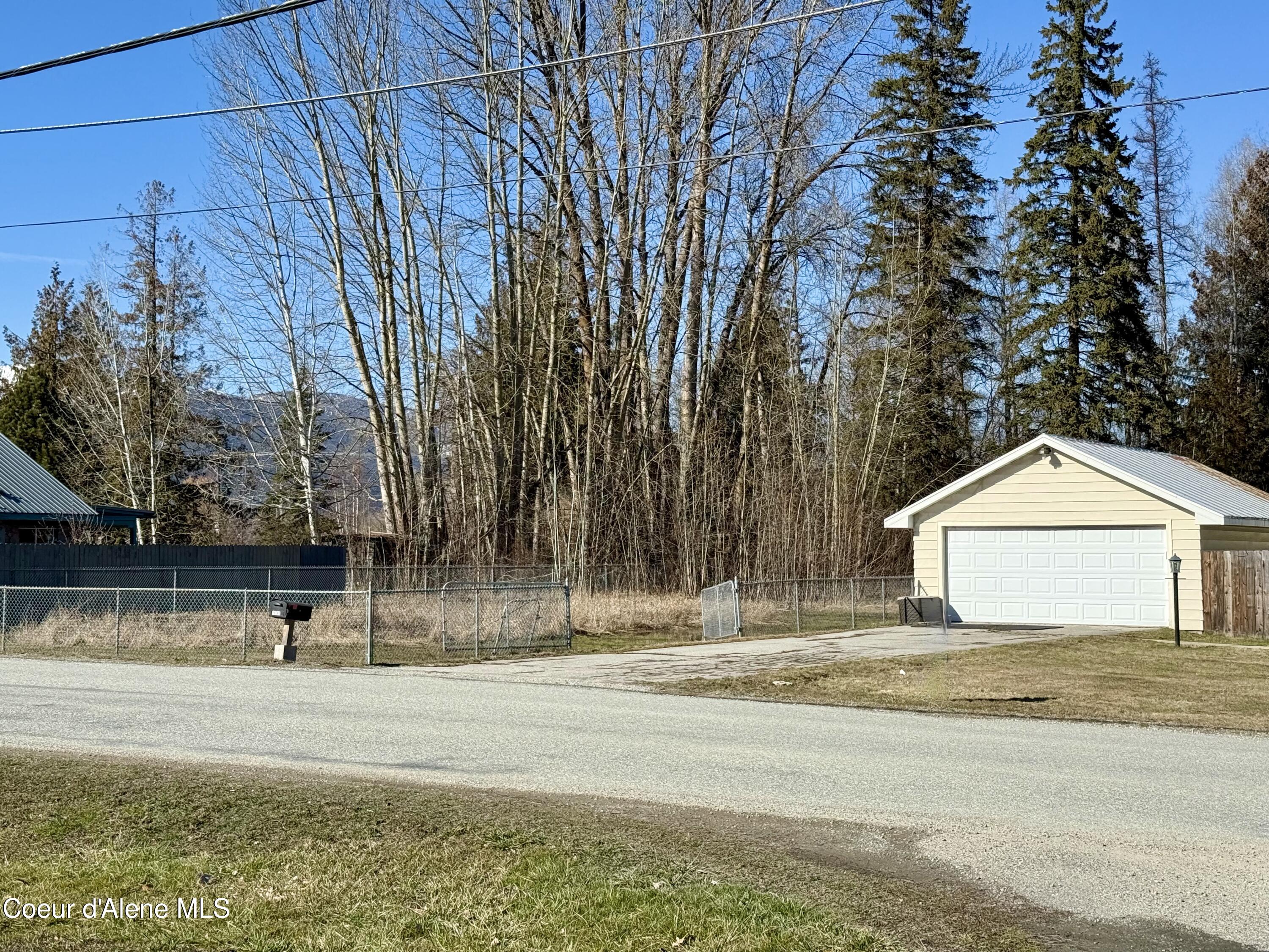 61 Whiskey Jack Road Sandpoint, ID 83864 - Photo 3 of 59 House Side Yard