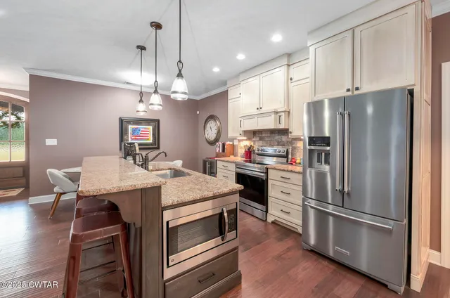 a spacious bedroom with a bed and a window