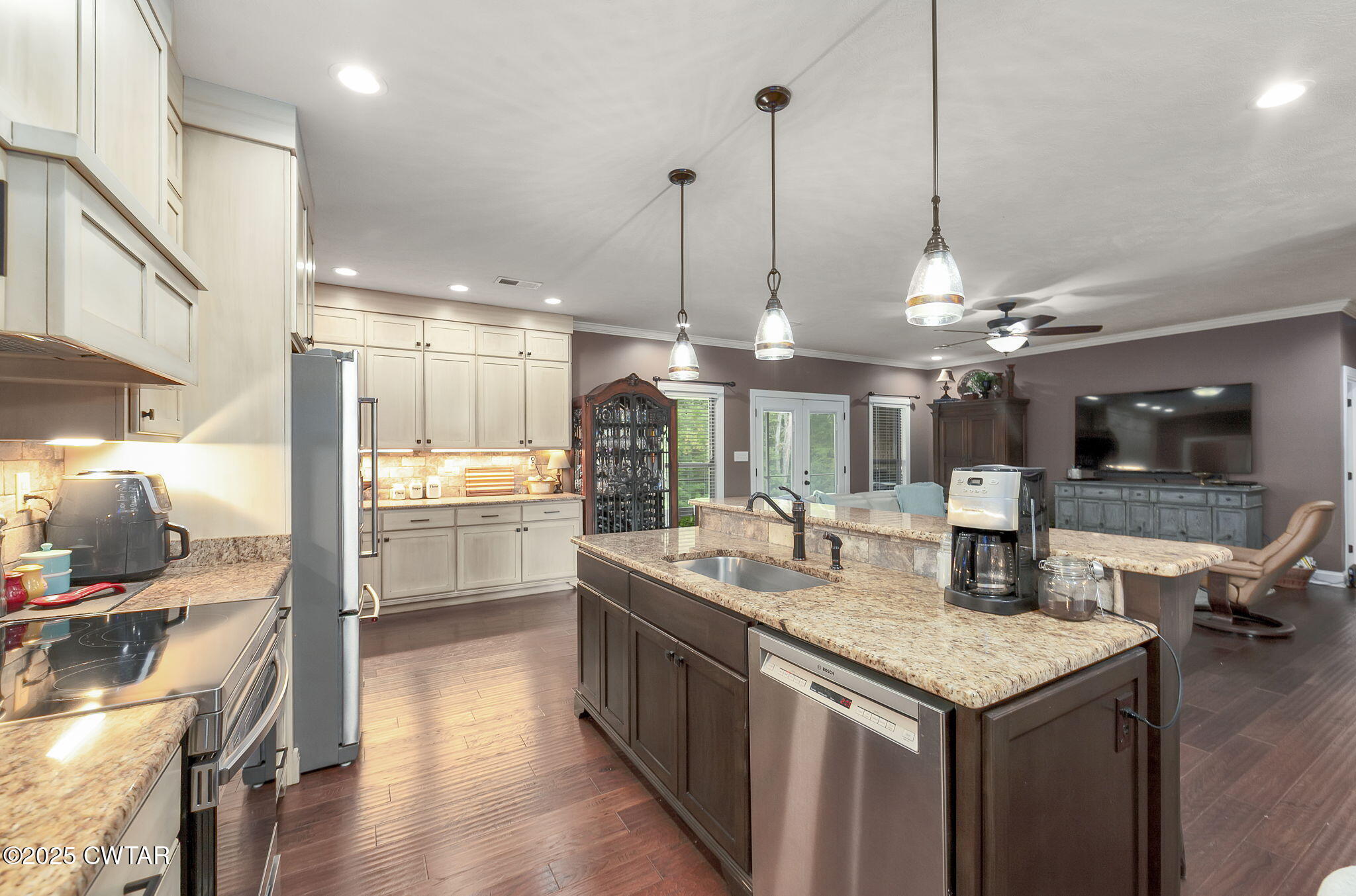 325 Ridgewood Drive Henderson, TN 38340 - Photo 14 of 63 a kitchen with counter top space and wooden floor