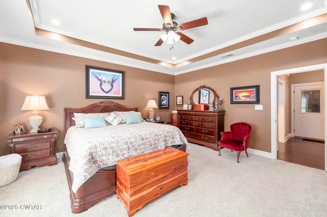 a living room with furniture flat screen tv and wooden floor