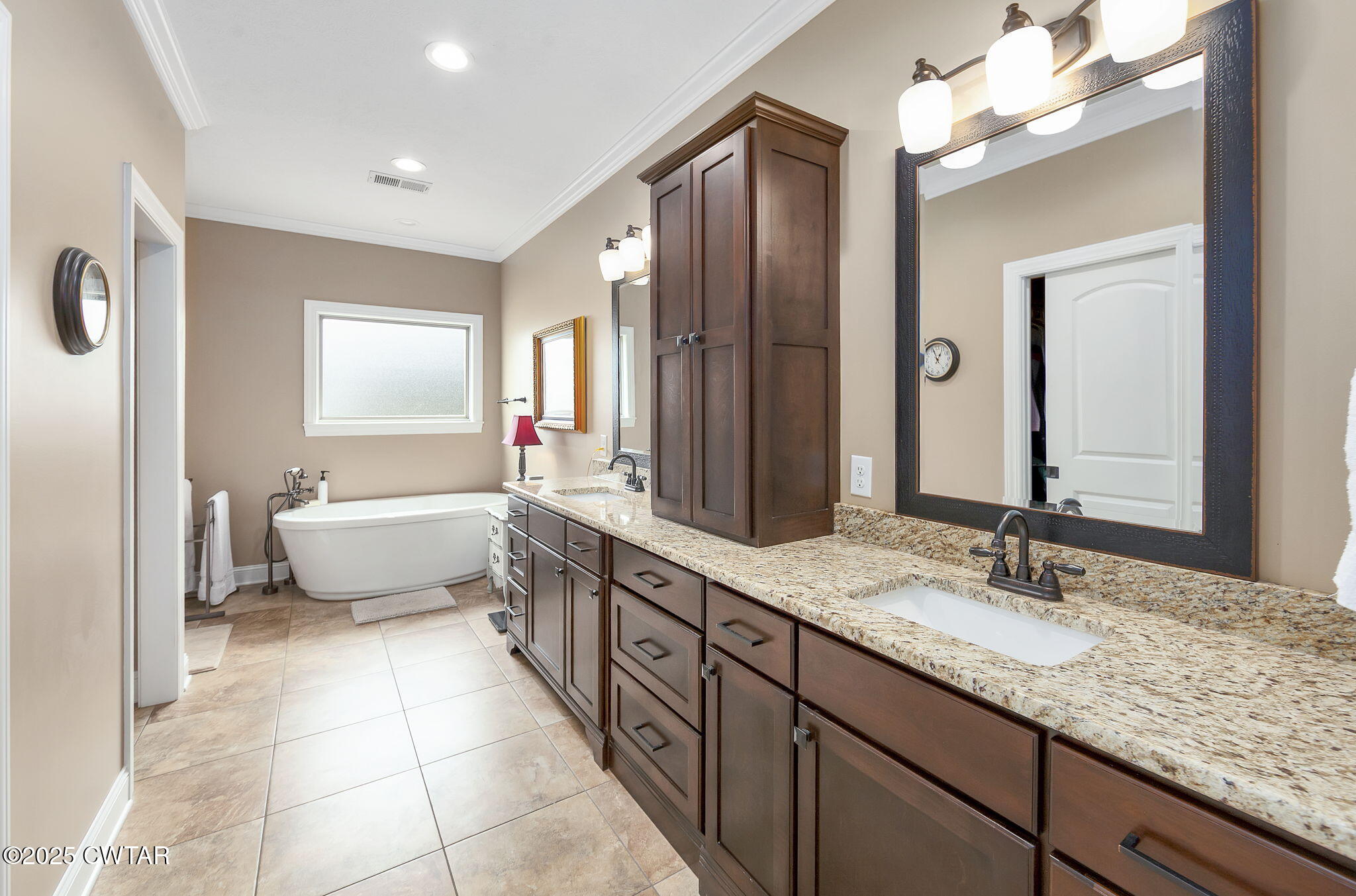 325 Ridgewood Drive Henderson, TN 38340 - Photo 17 of 63 a spacious bathroom with a double vanity sink mirror and a bathtub
