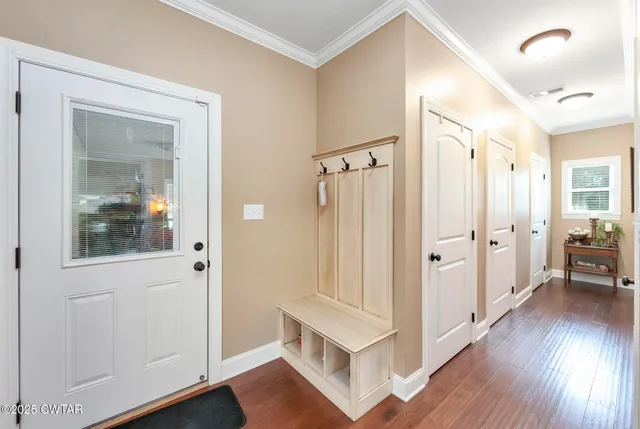 a aerial view of a house with swimming pool table and chairs