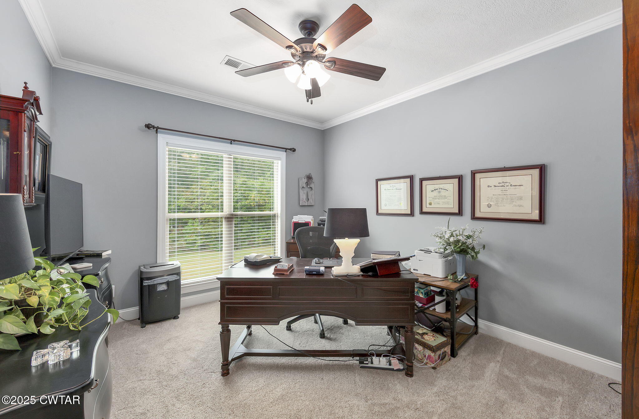 325 Ridgewood Drive Henderson, TN 38340 - Photo 29 of 63 a living room with furniture and a potted plant