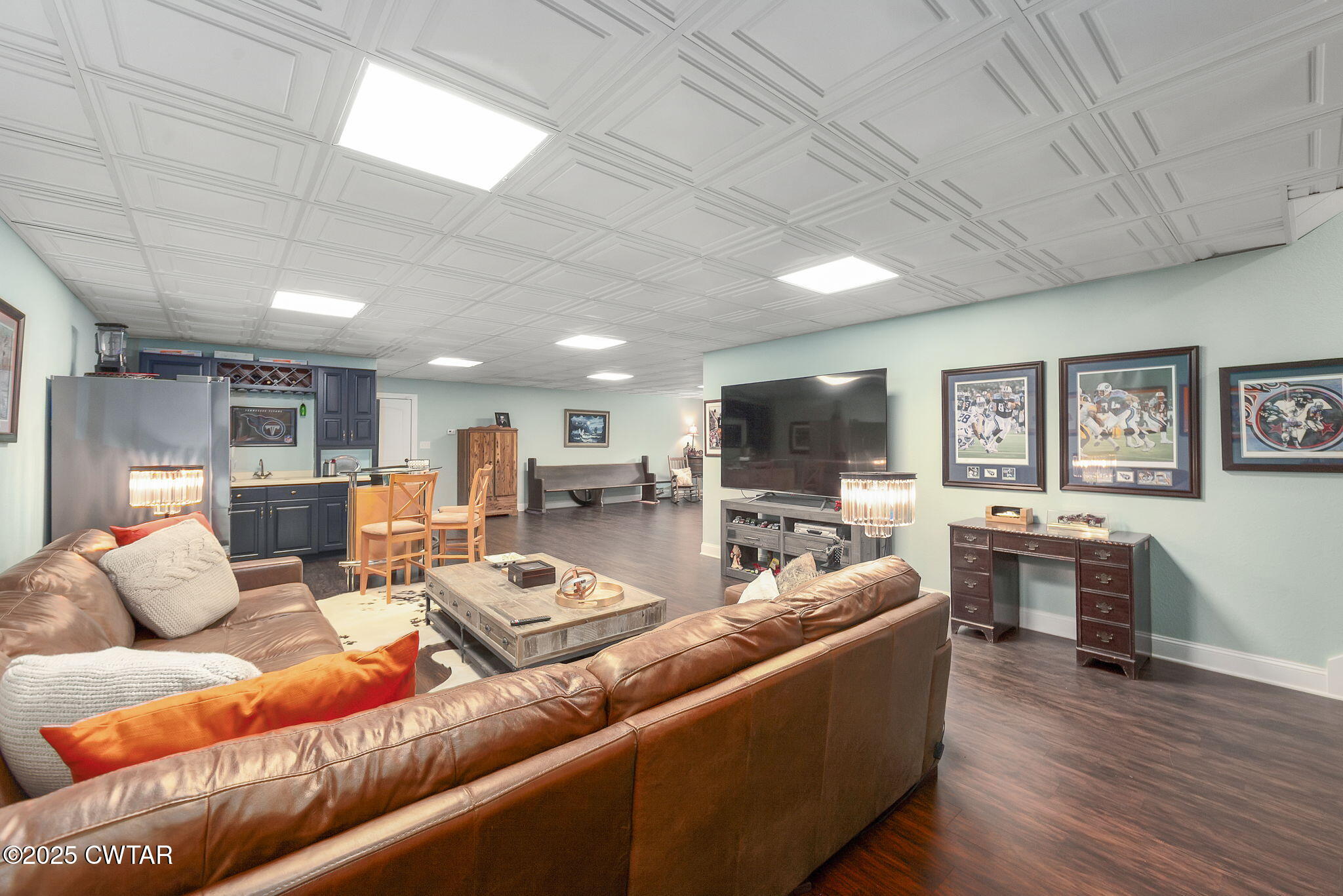 325 Ridgewood Drive Henderson, TN 38340 - Photo 31 of 63 a living room with furniture flat screen tv and wooden floor