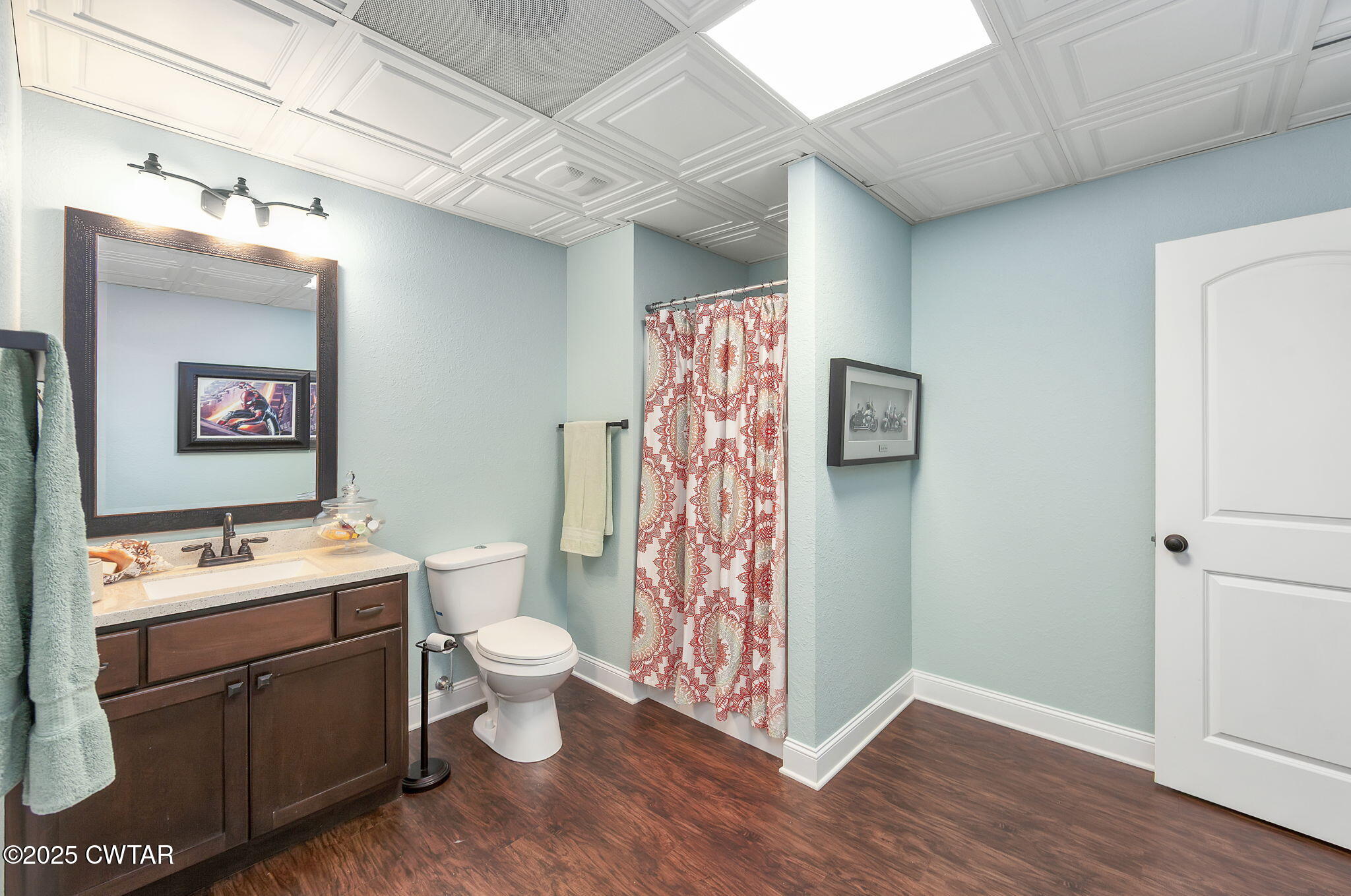 325 Ridgewood Drive Henderson, TN 38340 - Photo 38 of 63 a bathroom with a sink a toilet and shower curtain