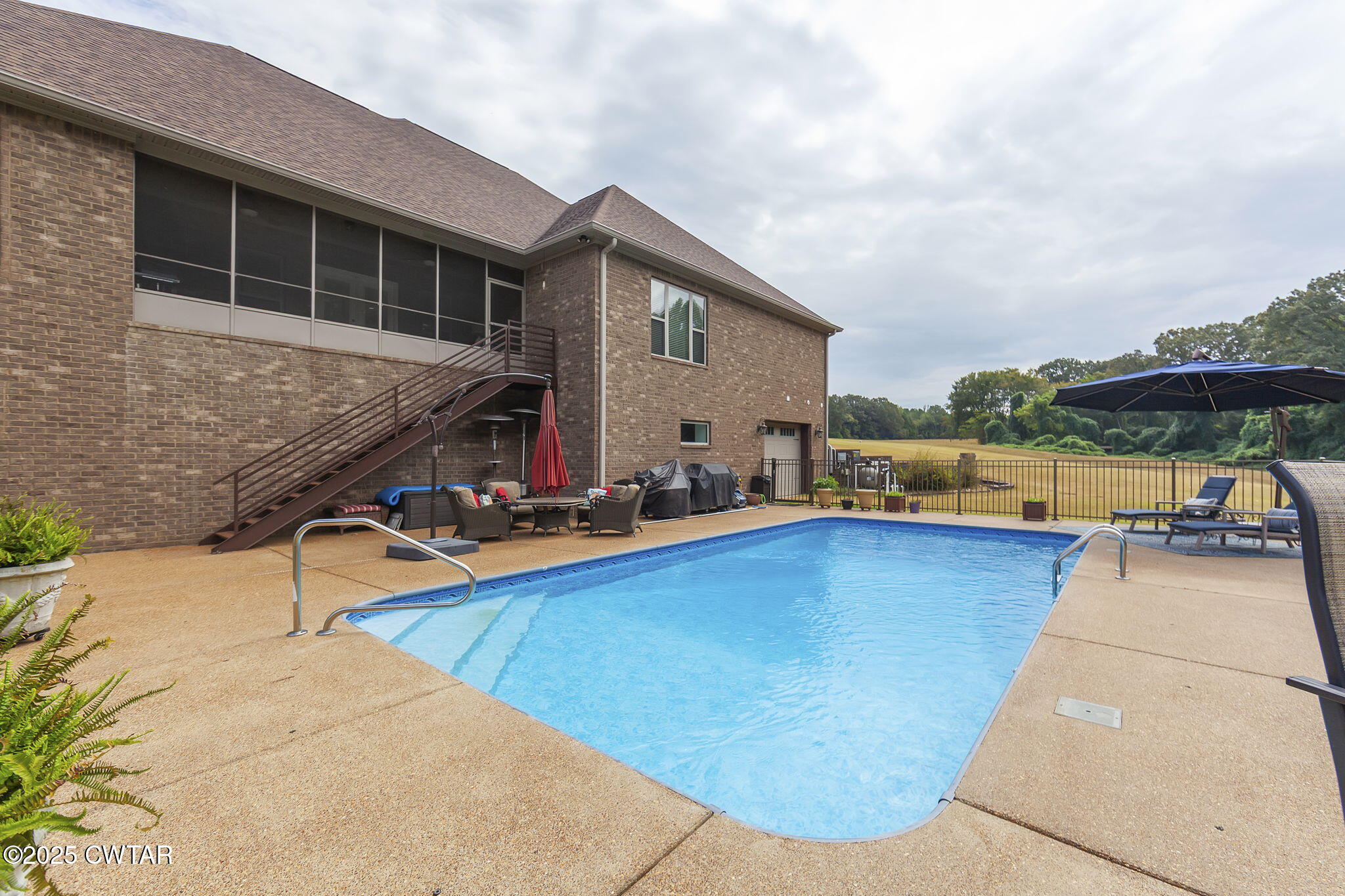 325 Ridgewood Drive Henderson, TN 38340 - Photo 43 of 63 a view of a house with swimming pool and sitting area