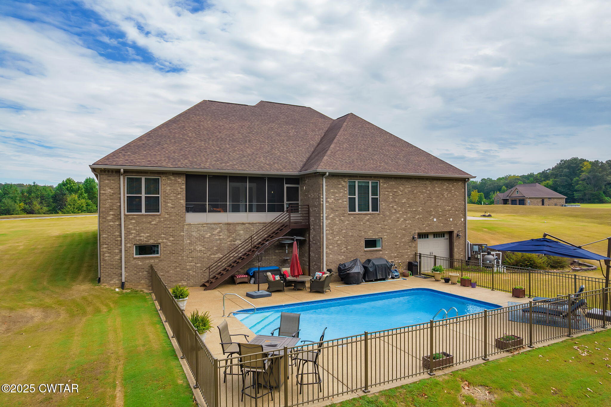 325 Ridgewood Drive Henderson, TN 38340 - Photo 50 of 63 a aerial view of a house with swimming pool table and chairs