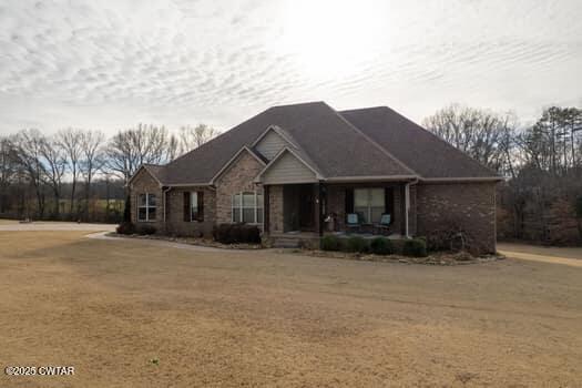 325 Ridgewood Drive Henderson, TN 38340 - Photo 60 of 63 a front view of a house with a yard
