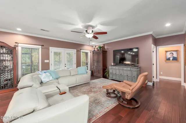 a kitchen with counter top space and wooden floor