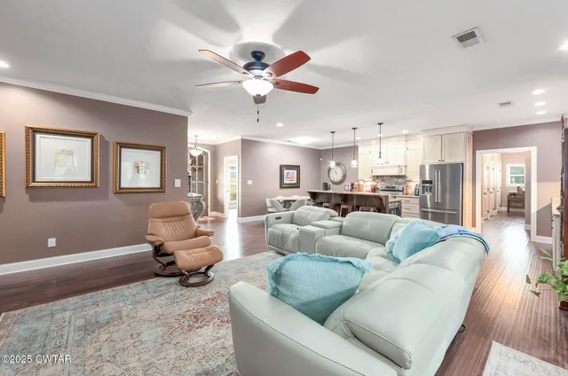 a white bath tub sitting next to a white sink