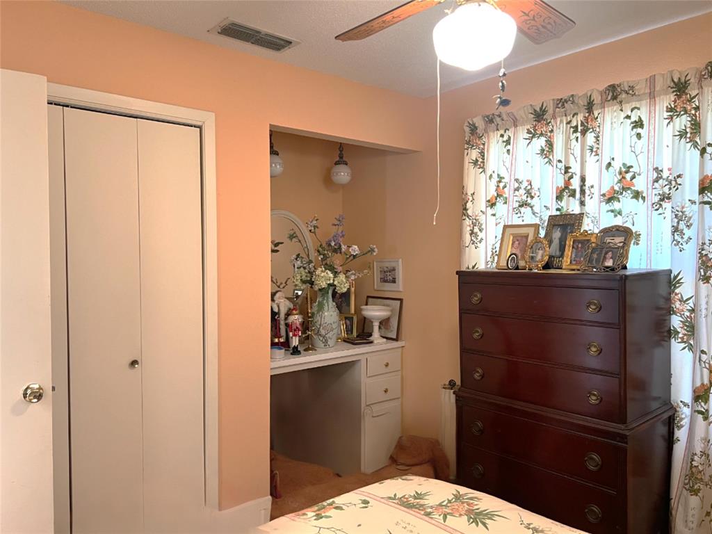 316 East Spring Street Henrietta, TX 76365 - Photo 28 of 28 a bathroom with a sink vanity and a mirror