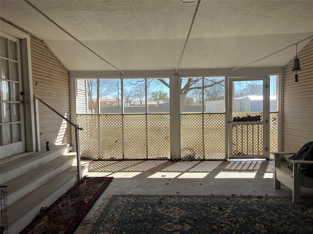 316 East Spring Street Henrietta, TX 76365 - Photo 5 of 28 a view of a house with a backyard