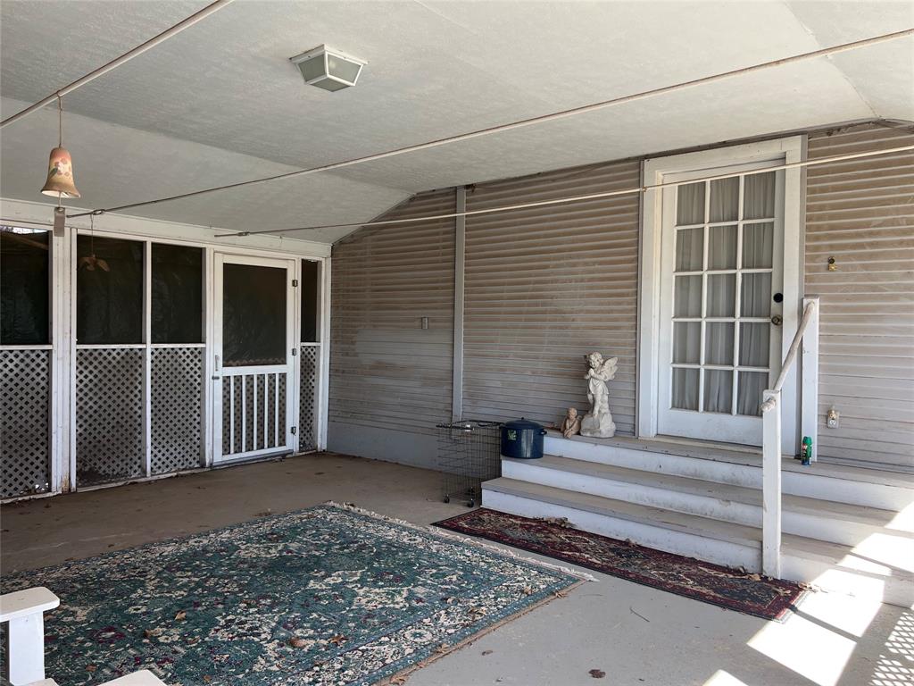 316 East Spring Street Henrietta, TX 76365 - Photo 7 of 28 a view of a house with a balcony