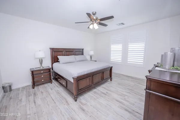 a bedroom with a bed and window