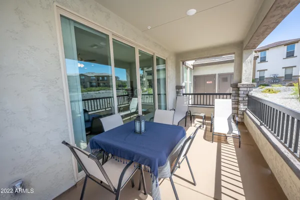 a view of a dining room with furniture and a window
