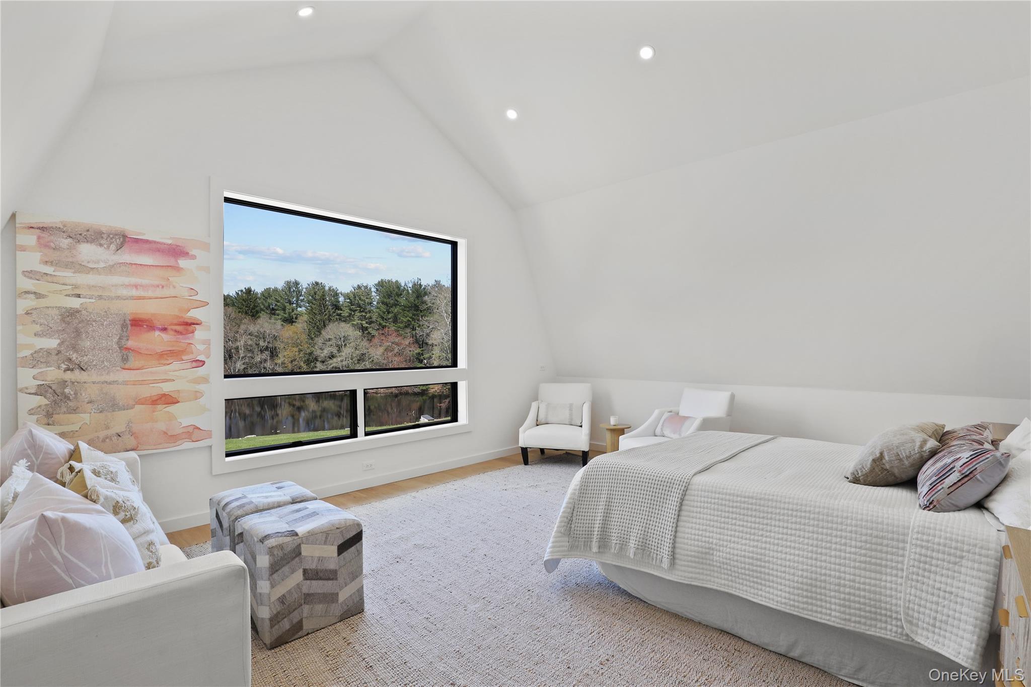 39 Old Snake Hill Road Pound Ridge, NY 10576 - Photo 25 of 37 a bedroom with a bed and a large window