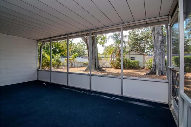 a view of a room with window and furniture