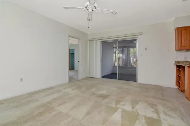 a view of an empty room with a bathroom