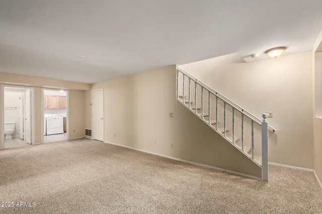 a view of an empty room with stairs