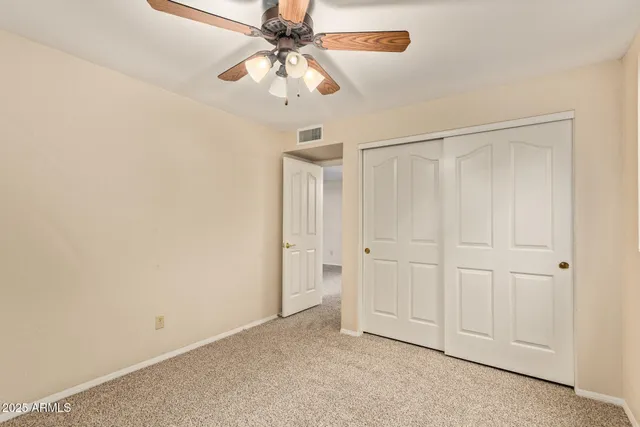 an empty room with fan
