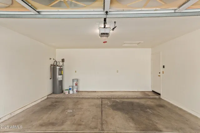 a view of a porch with wooden floor and iron fence