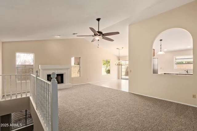 a view of livingroom with furniture fireplace and window