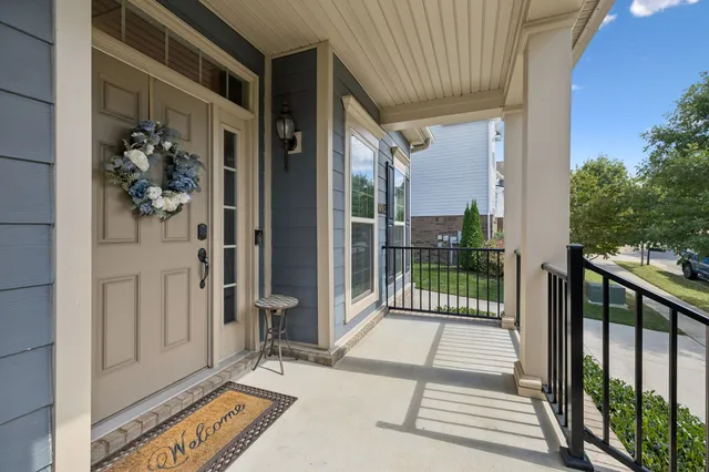 a view of a balcony with wooden floor