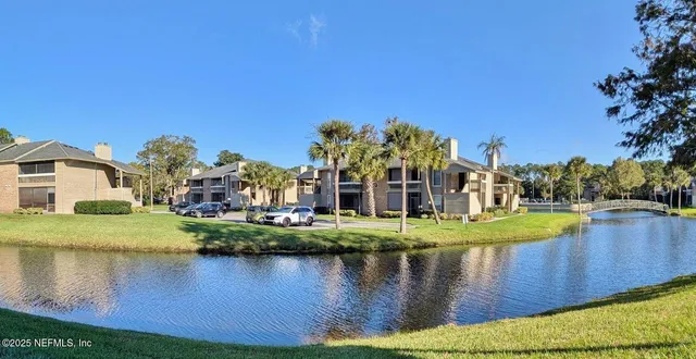 a view of a house with a yard and a large pool
