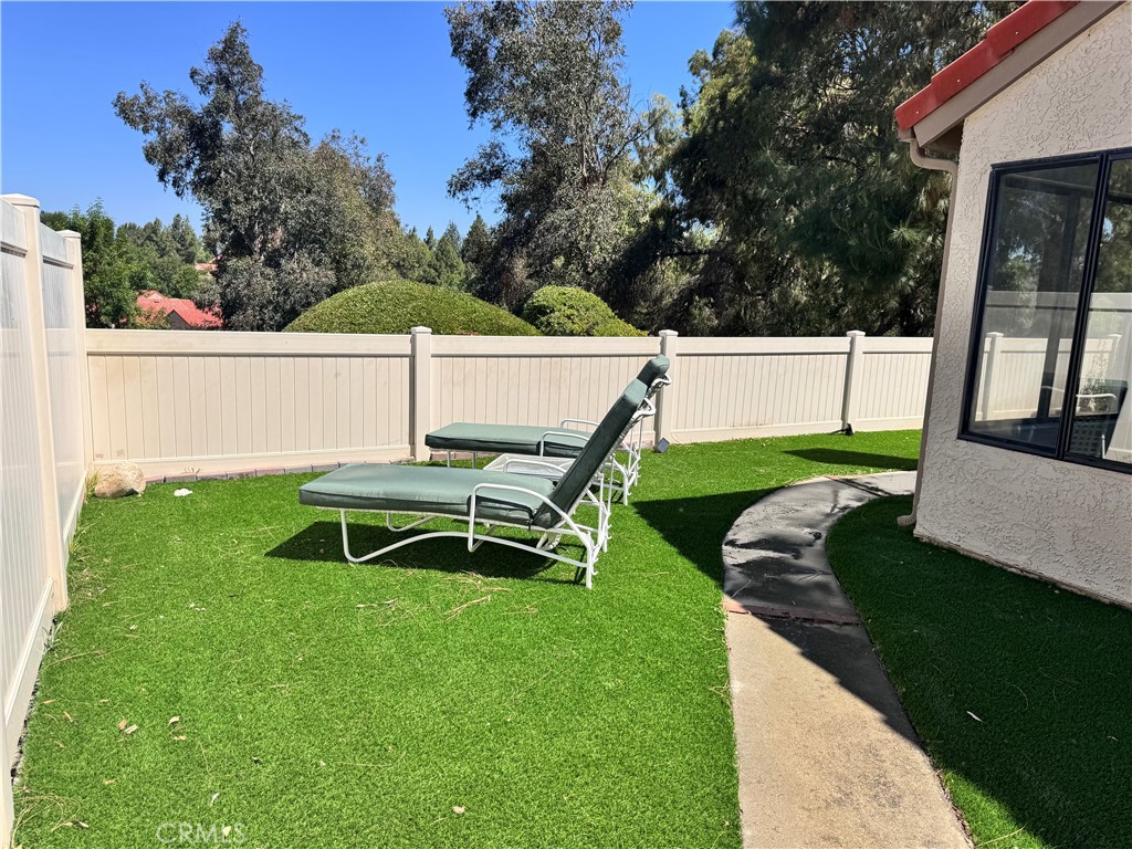 26226 Rainbow Glen Drive Newhall, CA 91321 - Photo 16 of 27 a view of a chair and table in the garden