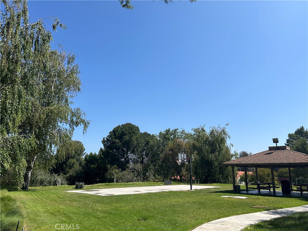 26226 Rainbow Glen Drive Newhall, CA 91321 - Photo 20 of 27 a view of a house with a yard