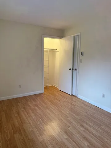 a bathroom with a bath tub a toilet and a shower