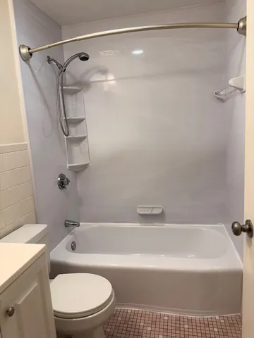 a bathroom with a sink a toilet and mirror