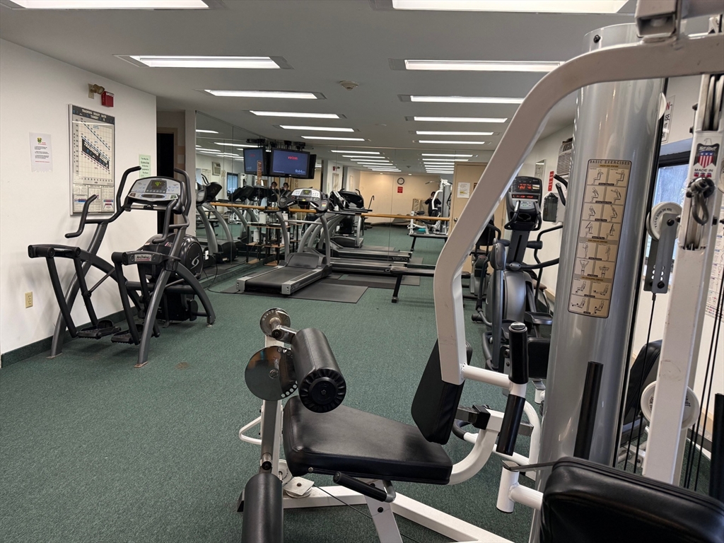 1325 Worcester Road, Unit D8 Framingham, MA 01701 - Photo 20 of 20 a room with gym equipment and windows