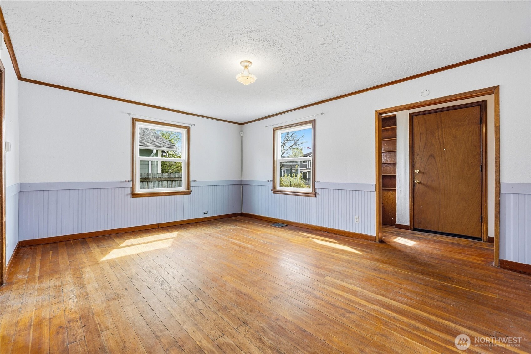 2836 Patton Street Bellingham, WA 98225 - Photo 5 of 40 an empty room with wooden floor and windows