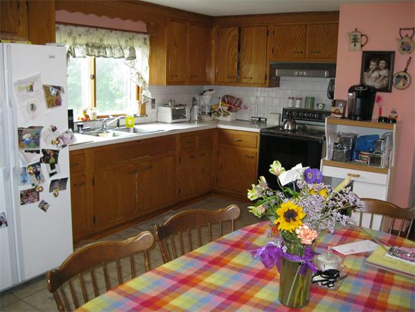 329 River Road Andover, MA 01810 - Photo 6 of 21 a kitchen with a sink window and cabinets