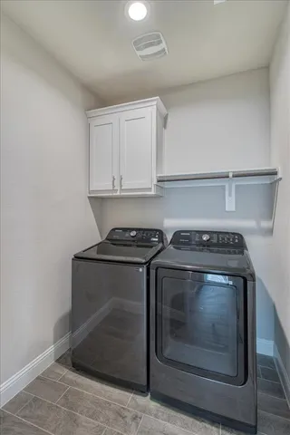 a stove top oven sitting inside of a kitchen