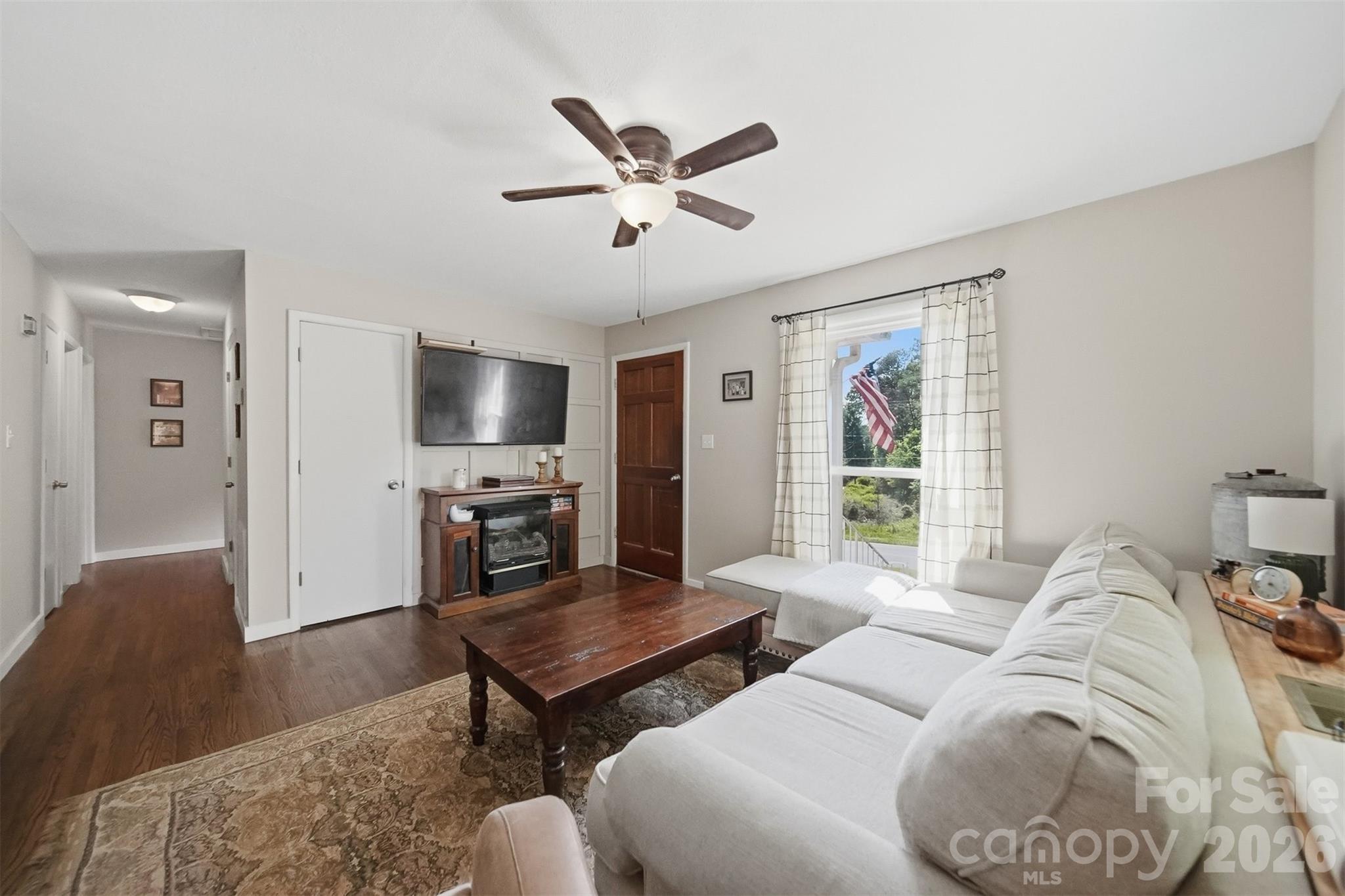 1312 County Home Road Conover, NC 28613 - Photo 6 of 25 a living room with furniture and a flat screen tv