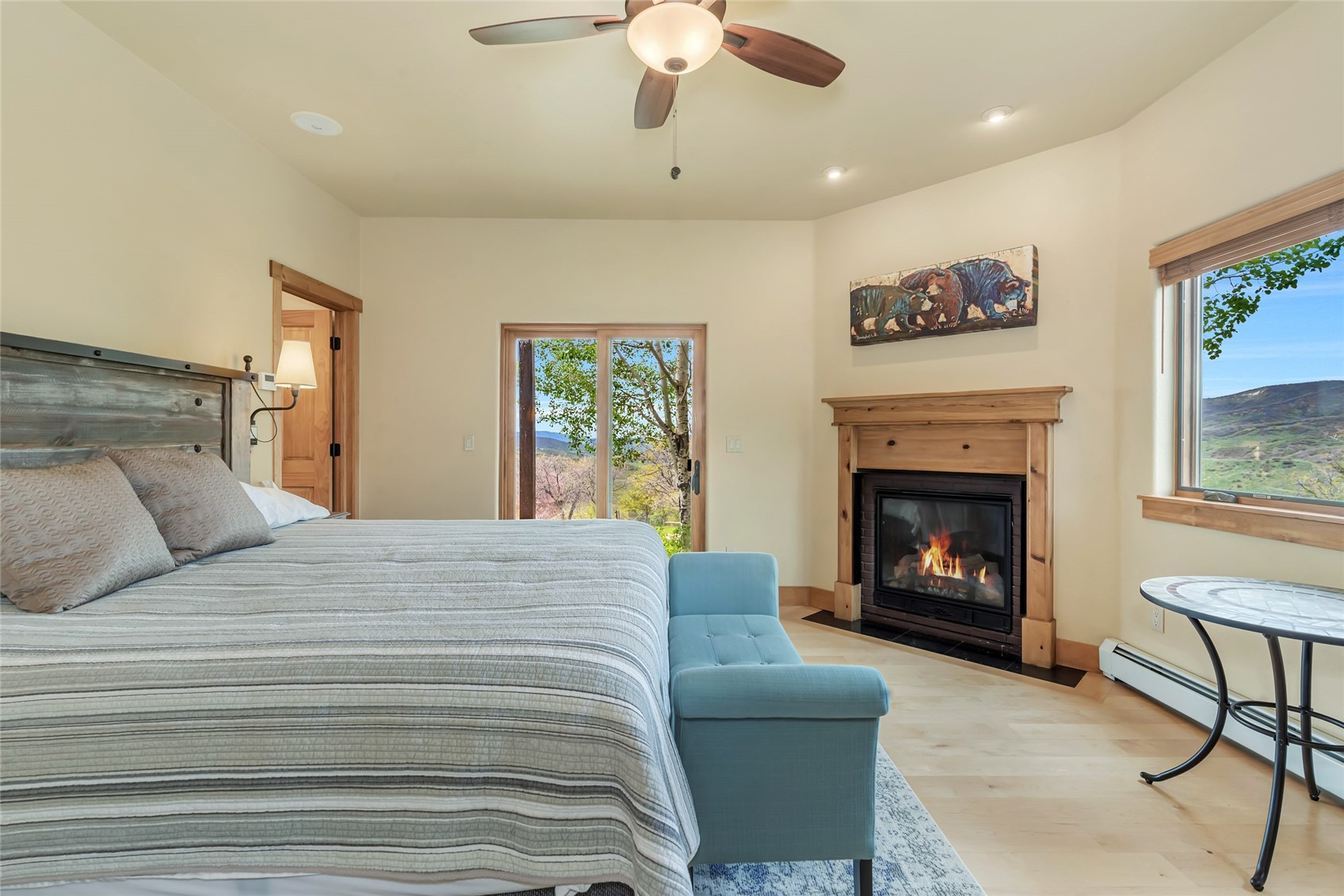 31485 Deerwood Ranch Road Steamboat Springs, CO 80487 - Photo 34 of 49 a bedroom with a bed and a fireplace